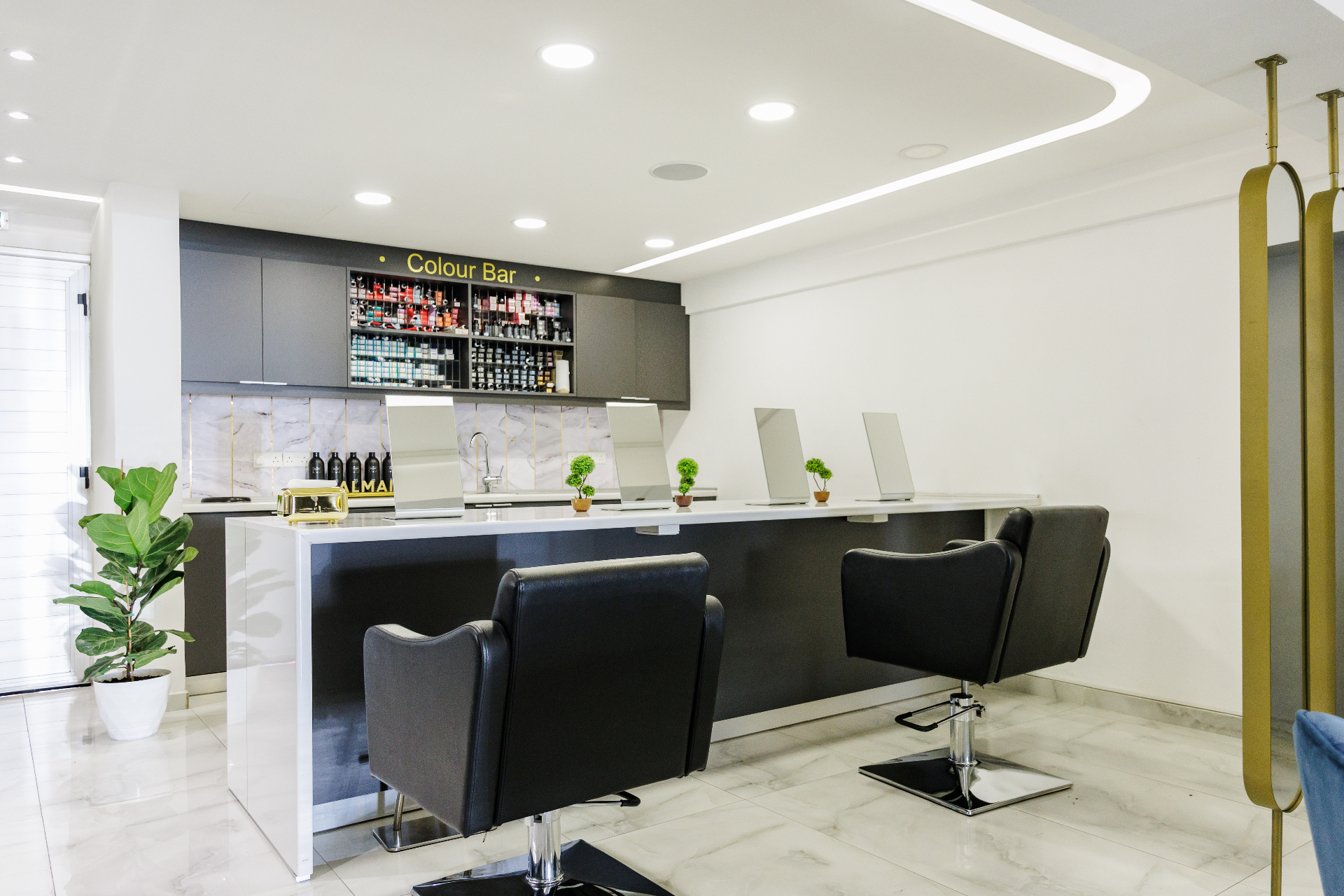 Signature styling chairs in front of the Color Bar