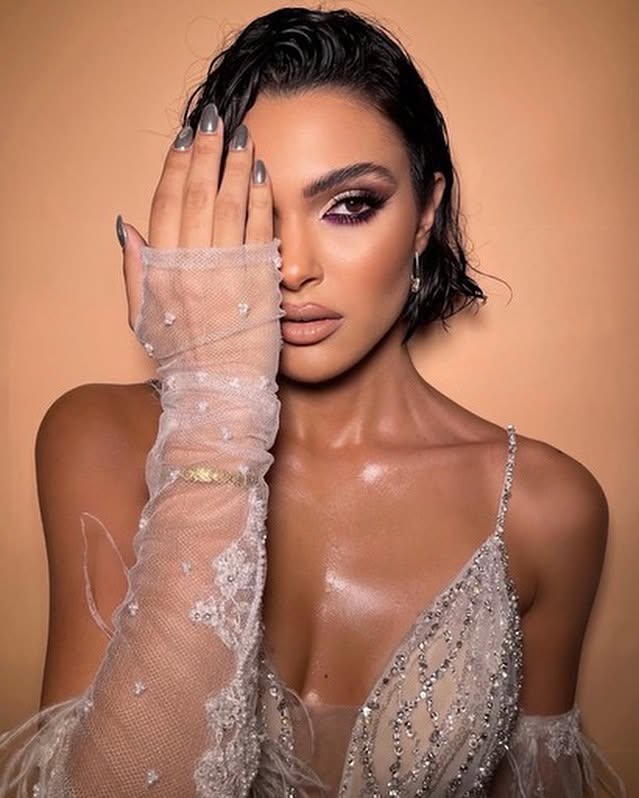 Editorial portrait styled by Giannis Karaolis with wet-look short hair and lace glove detail